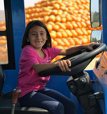 Smiling kid holding steering wheel